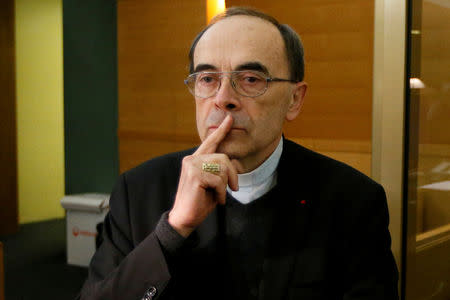 FILE PHOTO: Cardinal Philippe Barbarin, Archbishop of Lyon, arrives to attend his trial, charged with failing to act on historical allegations of sexual abuse of boy scouts by a priest in his diocese, at the courthouse in Lyon, France, January 7, 2019. REUTERS/Emmanuel Foudrot/File Photo