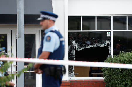 Police stand next to a building at the site of the shooting outside Linwood Mosque in Christchurch, New Zealand March 18, 2019. REUTERS/Edgar Su