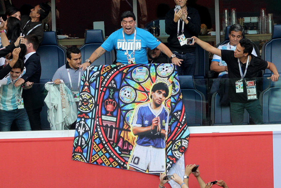 Diego Maradona holds a banner of himself in the stands before the FIFA World Cup Group D match at Saint Petersburg Stadium. Picture date: Tuesday June 26, 2018. (Getty Images)