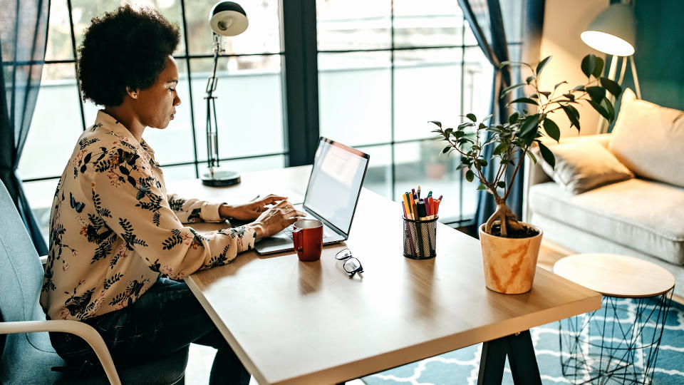 Hispanic Business Woman Working From Home Office.