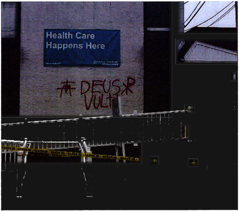 The phrase “Deus Vult” spray-painted in red letters on a Planned Parenthood facility in Newark by Samuel Gulick.