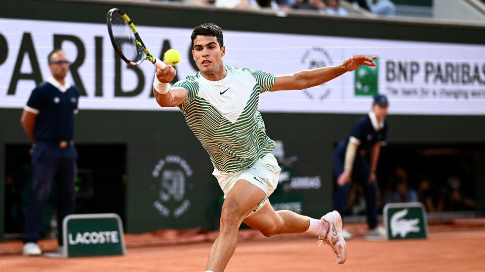 Seen here, Carlos Alcaraz hits a shot in his French Open quarter-final win against Stefanos Tsitsipas.