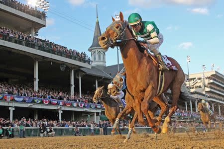 Nov 3, 2018; Louisville, KY, USA; Jockey Joel Rosario aboard Accelerate wins the Breeders Cup Classic during the 35th Breeders Cup world championships at Churchill Downs. Mandatory Credit: Brian Spurlock-USA TODAY Sports