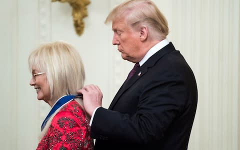 President Donald Trump awards the Medal of Freedom to Miriam Adelson, a doctor and philanthropist who is married to businessman and Republican megadonor Sheldon Adelson - Credit:  UPI / Barcroft Images