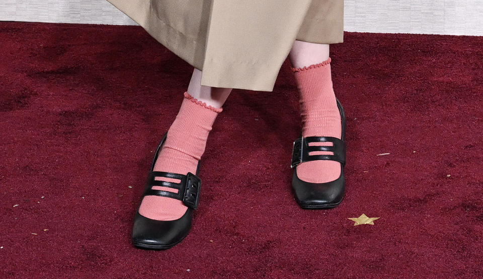 Billie Eilish, heels, high heels, Mary Janes, Mary Jane shoes, Mary Jane heels, black heels, black Mary Janes, buckle Mary Janes, Willy Chavarria, Willy Chavarria spring 2024, blazer, navy blazer, shorts, socks, pink socks, Golden Globe Awards, Golden Globes, red carpet, celebrity red carpet, awards