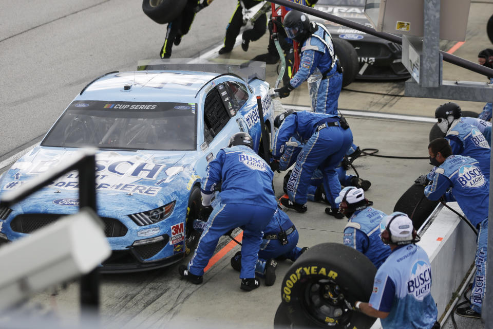 Kevin Harvick (4) makes a pit stop during the NASCAR Cup Series auto race Sunday, May 17, 2020, in Darlington, S.C. (AP Photo/Brynn Anderson)