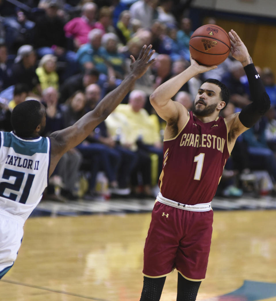 College of Charleston guard Grant Riller shoots over UNC Wilmington guard Ty Taylor during an NCAA college basketball game in Wilmington, N.C., Saturday, Feb. 17, 2018. (Matt Born/The Star-News via AP)