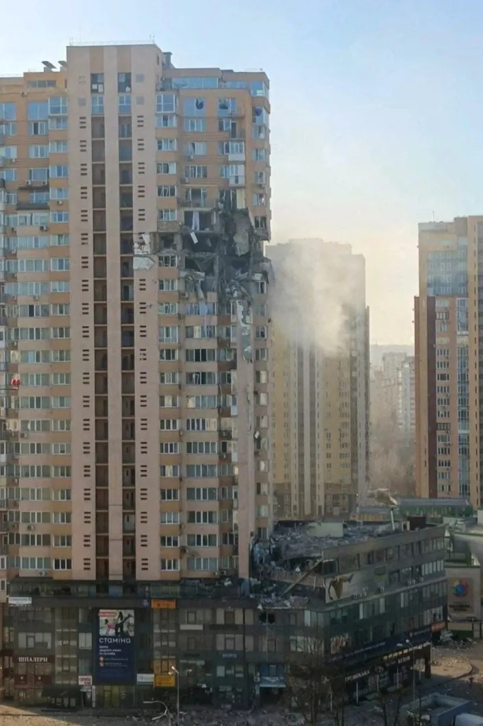 A view shows a high-rise apartment block which was hit by overnight shelling in Kyiv on February 26, 2022. (Photo by Handout / UKRAINE EMERGENCY MINISTRY PRESS SERVICE / AFP)