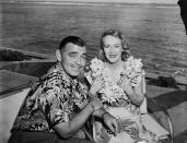 <p>Here, the happy couple sits by the water in paradise, following their wedding on a ranch near Solvang, California.</p>