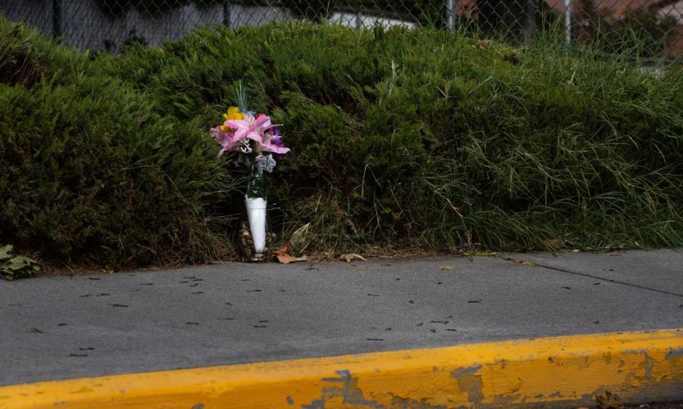 A vase of faux flowers stands as a memorial for the Pasco School District bus driver Richard Lenhart, who was stabbed in 2021 outside of Longfellow Elementary in front of over 30 children who had already boarded for afternoon dismissal.