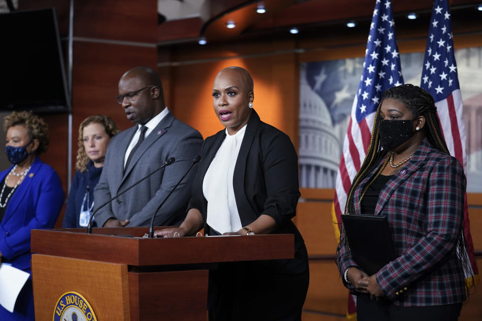 Rep. Ayanna Pressley, D-Mass., tells reporters she is introducing a resolution to strip Rep. Lauren Boebert, R-Colo., of her committee assignments for repeatedly making anti-Muslim remarks aimed at Rep. Ilhan Omar, D-Minn., at the Capitol in Washington, Wednesday, Dec. 8, 2021. She is joined by, from left, Rep. Barbara Lee, D-Calif., Rep. Debbie Wasserman Schultz, D-Fla., Rep. Jamaal Bowman, D-N.Y., and Rep. Cori Bush, D-Mo. (AP Photo/J. Scott Applewhite)