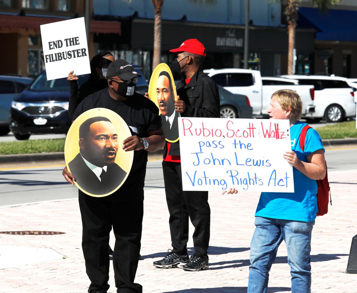 Protesters gather at the base of the International Speedway Boulevard bridge in Daytona Beach in support of the John Lewis Voting Rights Act. The event was organized by the Volusia County Democratic Black Caucus, while members of the Daytona Beach/Volusia County NAACP and the Daytona Beach Black Clergy Alliance also joined in the protest.