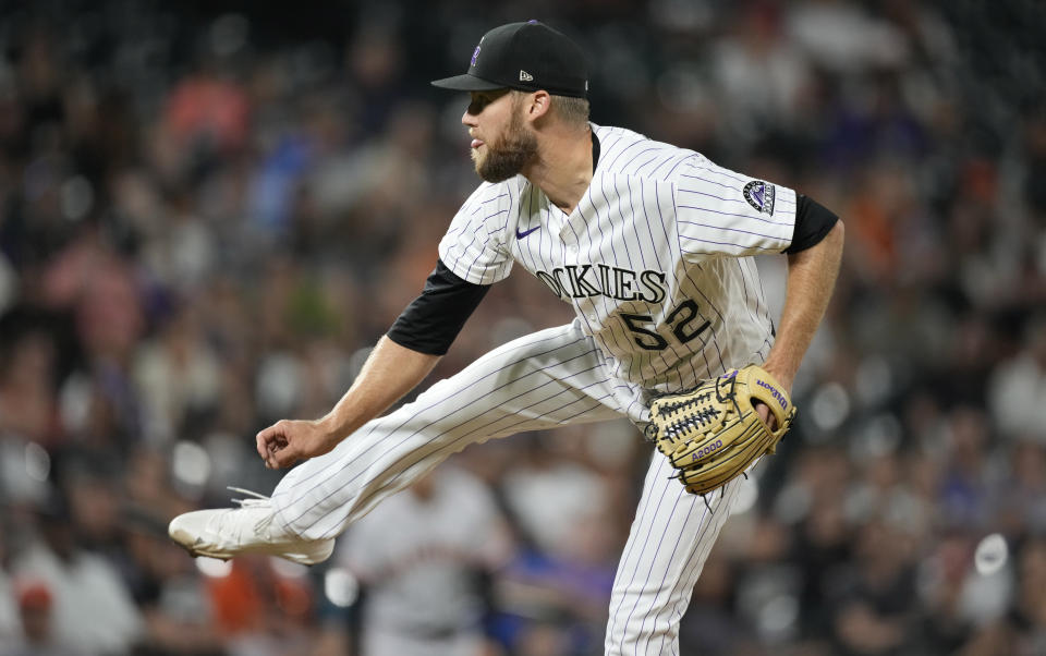 Colorado Rockies relief pitcher Daniel Bard watches a throw to a San Francisco Giants batter during the ninth inning of a baseball game Friday, Aug. 19, 2022, in Denver. (AP Photo/David Zalubowski)