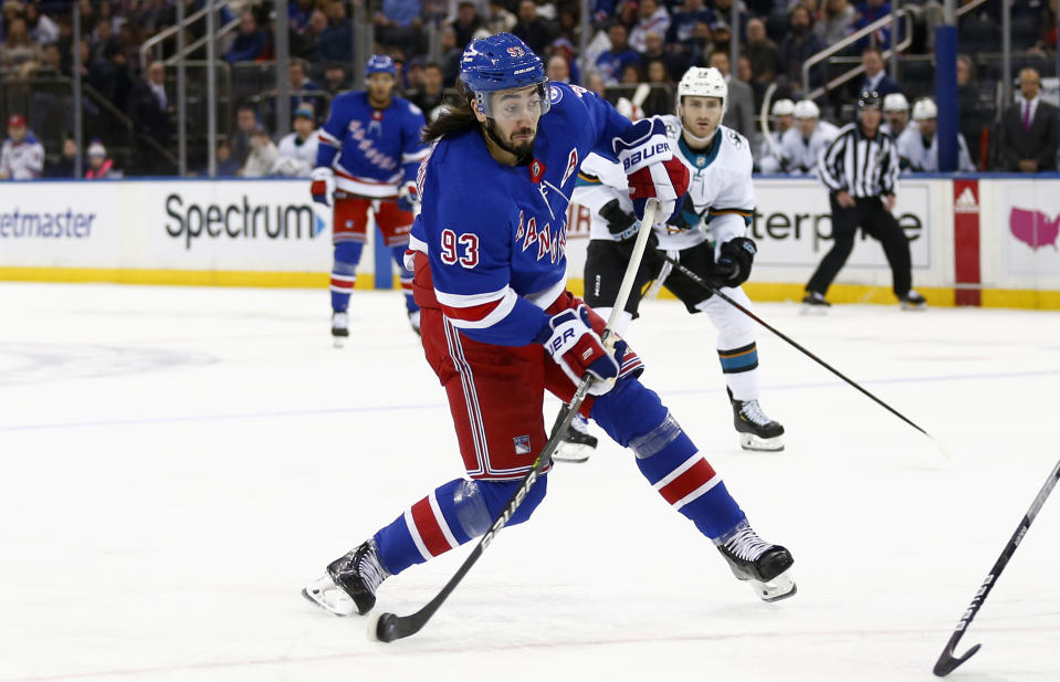 New York Rangers' Mika Zibanejad (93) shoots during the second period of an NHL hockey game against the San Jose Sharks, Friday, Dec. 3, 2021, in New York. (AP Photo/John Munson)