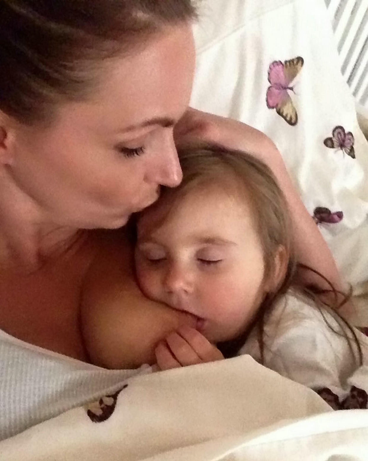 A mum has defended her right to continue breastfeeding her four-year-old [Photo: SWNS]