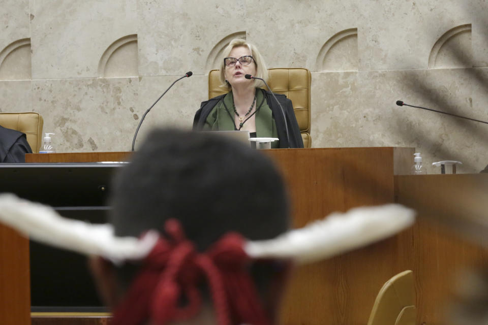 Supreme Court President Rosa Weber presides over a session to decide on whether to overturn or maintain a ruling on the legality of boundaries for vast Indigenous lands in Brasilia, Brazil, Thursday, Sept. 21, 2023. Six of the 11 Supreme Court justices went on to vote against establishing a cut-off date after which Indigenous peoples could not claim new territory. (AP Photo/Gustavo Moreno)