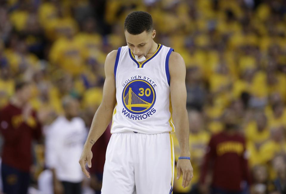 Stephen Curry walks on the floor during the second half of Game 5 of the 2016 NBA Finals. (AP/Marcio Jose Sanchez)