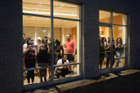 <p>Protestors take shelter in the Central Reform Jewish Congregation Center amid a protest action following a not guilty verdict oon Sept.15, 2017 in St. Louis, Mo. (Photo: Michael B. Thomas/Getty Images) </p>