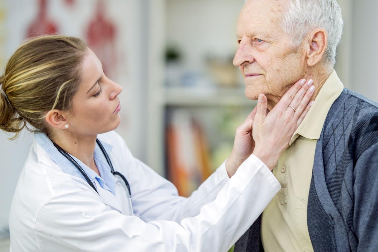 Senior man being examined by a doctor