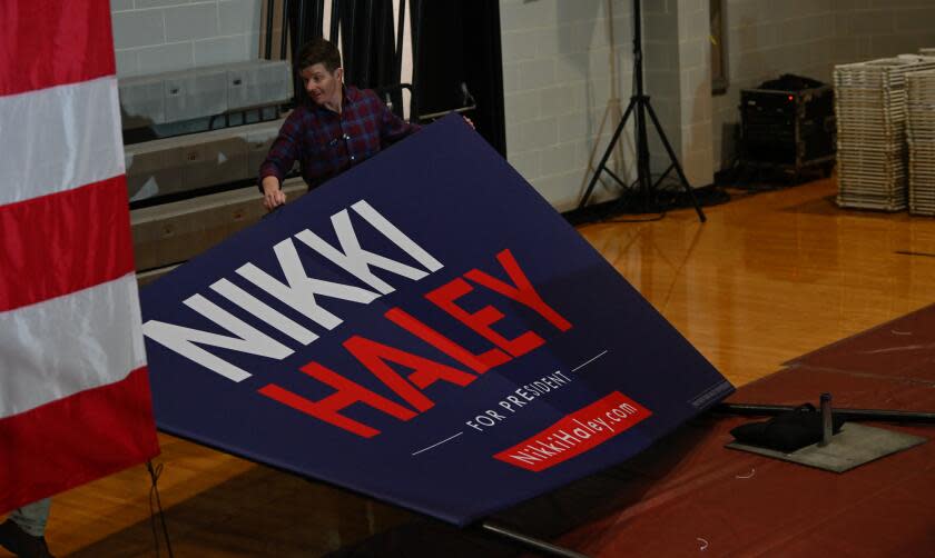 CONWAY, USA - JANUARY 28: A man lifts a banner written 'Nikki Haley for President' to prepare the campaign event venue hosted by Nikki Haley in Conway as part of her swing in the Palmetto State leading up to the State's primary, in Conway SC, United States on January 28, 2024. (Photo by Peter Zay/Anadolu via Getty Images)