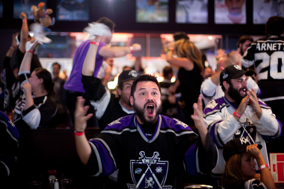 LOS ANGELES, CA - JUNE 11: Fans celebrate a goal scored by the Los Angeles Kings during Game 6 of the 2012 Stanley Cup Final June 11, 2012 in Los Angeles, California. A win in Game 6 against the New Jersey Devils would lead the Los Angeles Kings to their first championship in franchise history. (Photo by Jonathan Gibby/Getty Images)