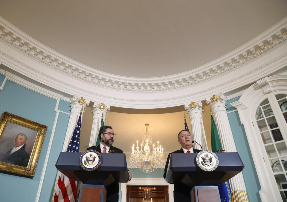 Secretary of State Mike Pompeo, right, and Brazilian Foreign Minister Ernesto Araujo, left, delivering remarks to members of the media at the Department of State in Washington, Friday, Sept. 13, 2019. (AP Photo/Pablo Martinez Monsivais)