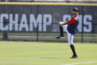 Atlanta Braves outfielder Eddie Rosario loosens up at baseball spring training in North Port, Fla., Thursday, March 17, 2022. (Curtis Compton/Atlanta Journal-Constitution via AP)