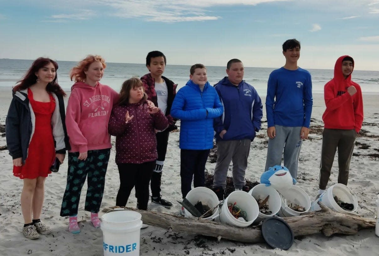 From left, students in Hampton Academy's Extended Learning Program Kelly M., Paige B., Reagan S., Kevin H., Mark H., Nick G., Max B., and Ayaan K. collected 25 pounds of trash at a beach cleanup organized by the Surfrider Foundation's New Hampshire Chapter.