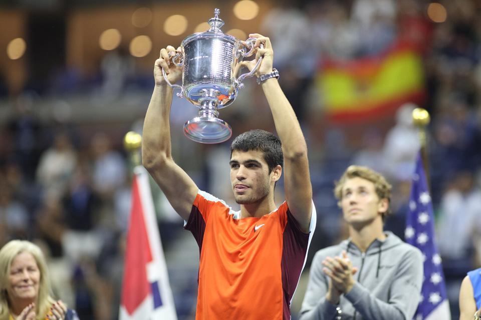 Carlos Alcaraz of Spain with the winner's trophy after his victory against Casper Rudd of Norway in the Mens Singles Final match on Arthur Ashe Stadium with the roof closed during the US Open Tennis Championship 2022