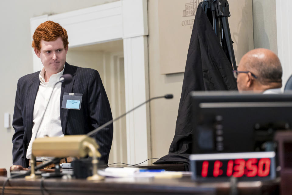 Buster Murdaugh, left, the son of Alex Murdaugh, listens to instruction from Judge Clifton Newman before a break during his father's trial at the Colleton County Courthouse in Walterboro, S.C., on Tuesday, Feb. 21, 2023. The 54-year-old attorney is standing trial on two counts of murder in the shootings of his wife and son at their Colleton County, S.C., home and hunting lodge on June 7, 2021. (Jeff Blake/The State via AP, Pool)