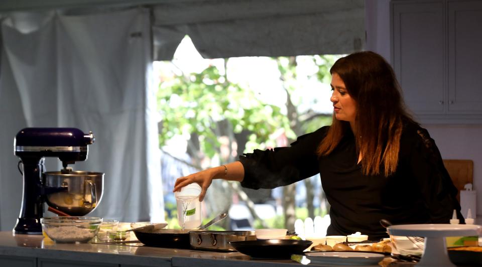 Chef Alex Guarnaschelli adds water to a recipe she was cooking in front of a packed audience inside The Sysco Culinary Stage at the Detroit Free Press Wine + Food Experience held at Cadillac Square in downtown Detroit, Michigan on Saturday, September 14, 2019.
