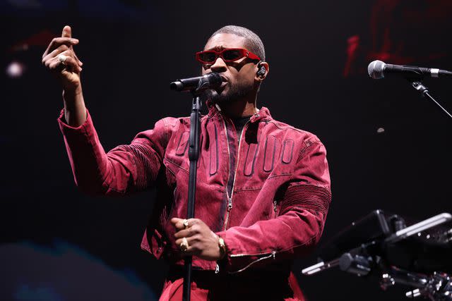 <p>Scott Legato/Getty Images for iHeartRadio</p> Usher performing in Detroit in December 2023