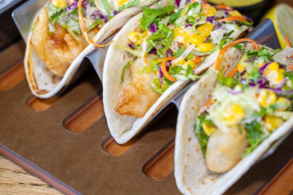 The Crispy Baja Fish Taco at Que Onda includes beer battered fish topped with chipotle slaw.