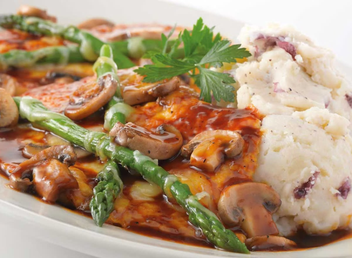 cheesecake factory's chicken madeira with asparagus, mushroom madeira sauce, and a side of mashed potatoes