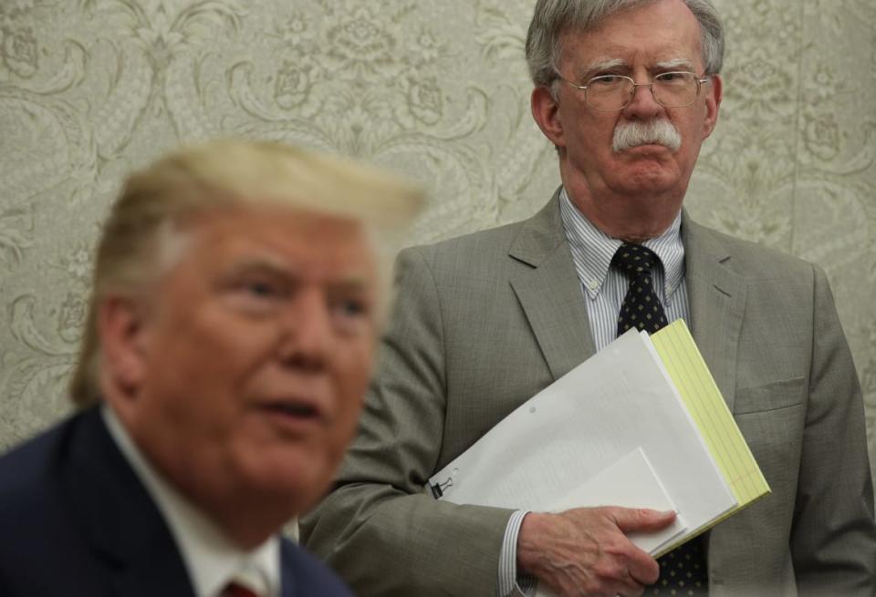 <div class="inline-image__caption"><p>John Bolton listens during a meeting with Donald Trump in the Oval Office in August, 2019.</p></div> <div class="inline-image__credit">Alex Wong/Getty </div>