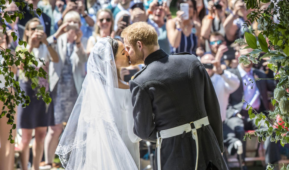 Harry and Meghan kiss after exiting St George’s Chapel (Picture: PA)