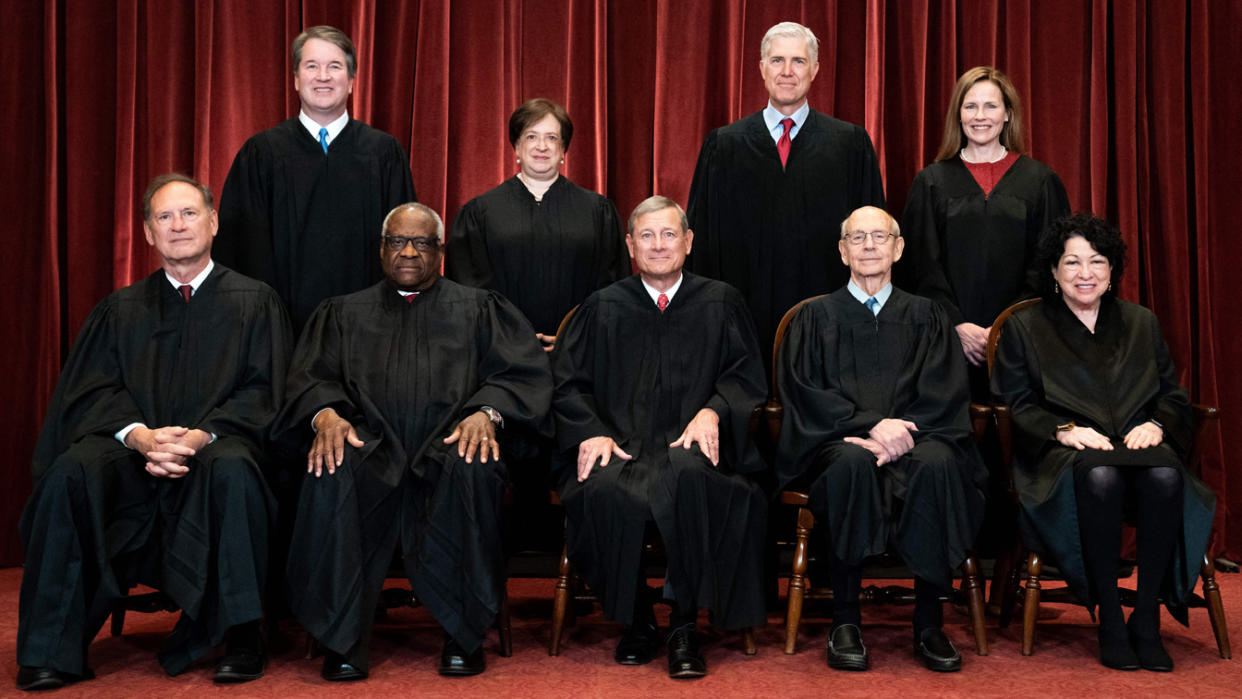 Seated from left: Associate Justice Samuel Alito, Associate Justice Clarence Thomas, Chief Justice John Roberts, Associate Justice Stephen Breyer and Associate Justice Sonia Sotomayor, standing from left: Associate Justice Brett Kavanaugh, Associate Justice Elena Kagan, Associate Justice Neil Gorsuch and Associate Justice Amy Coney Barrett pose during a group photo of the Justices at the Supreme Court in Washington, DC on April 23, 2021. (Photo by Erin Schaff / POOL / AFP) (Photo by ERIN SCHAFF/POOL/AFP via Getty Images)
