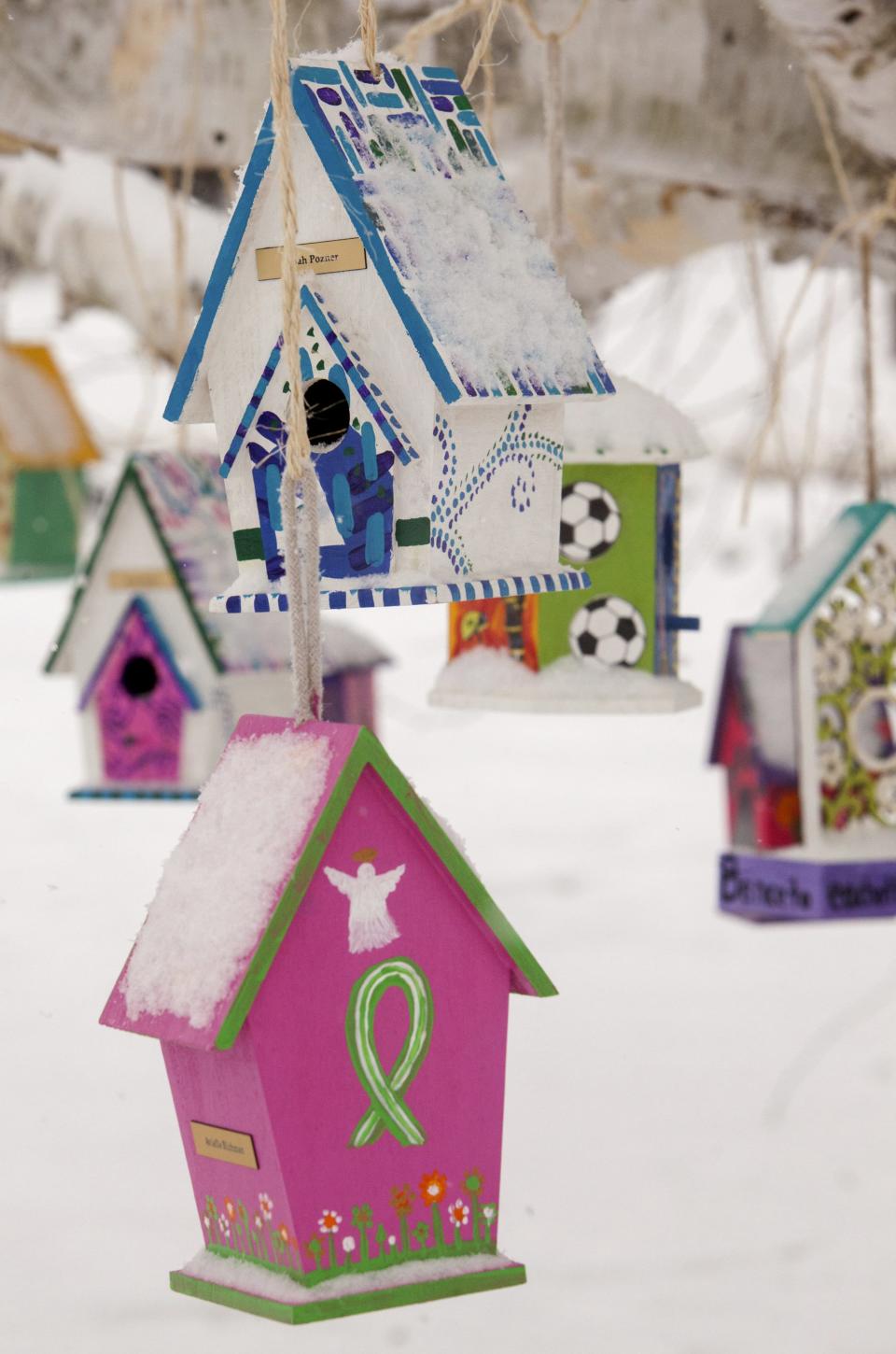 Personalized birdhouses are part of a memorial for the victims of the Sandy Hook Elementary School shooting in Newtown