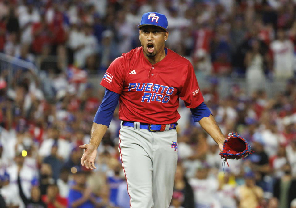 Puerto Rico pitcher Edwin Diaz reacts after striking out Dominican Republic pinch-hitter Jean Segura during the first inning of a Pool D game at the World Baseball Classic on Wednesday, March 15, 2023, in Miami. (David Santiago/Miami Herald via AP)