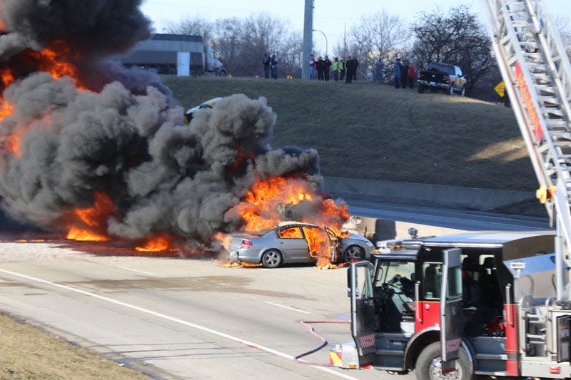 Firefighters battle a tanker fire that involved several vehicles on eastbound I-94 expressway near the Dearborn/Detroit border March 11, 2015.