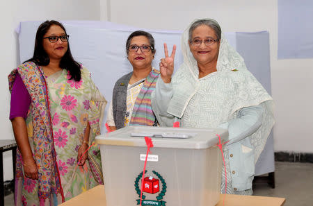Prime Minister Sheikh Hasina gestures after casting her vote in the morning during the general election in Dhaka, Bangladesh, December 30, 2018. Bangladesh Sangbad Sangstha/Handout via REUTERS
