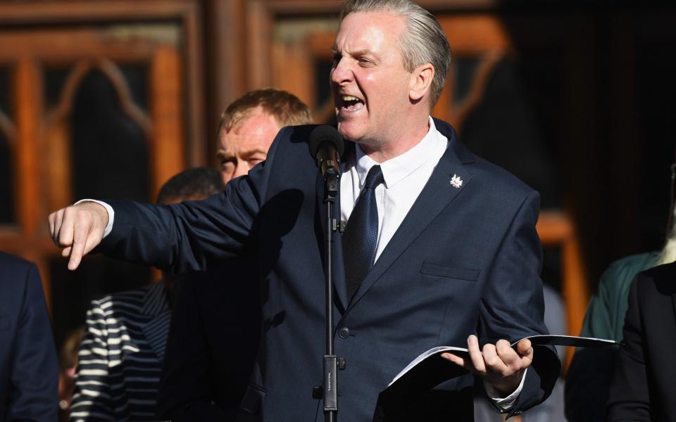  Poet Tony Walsh speaks as members of the public gather at a vigil - Credit: Getty