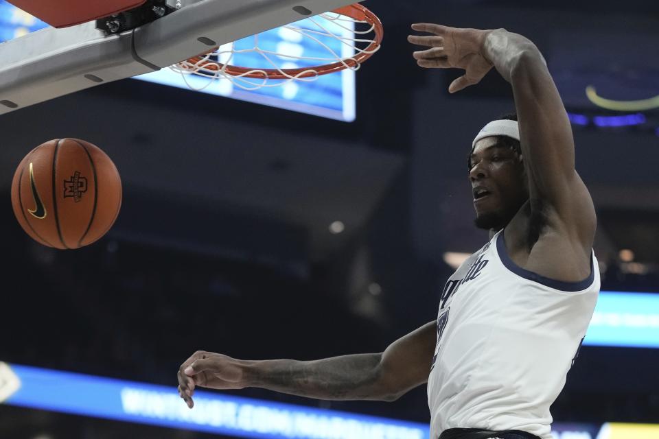 Marquette's Chase Ross dunks during the first half of an NCAA college basketball game Thursday, Dec. 14, 2023, in Milwaukee. (AP Photo/Morry Gash)