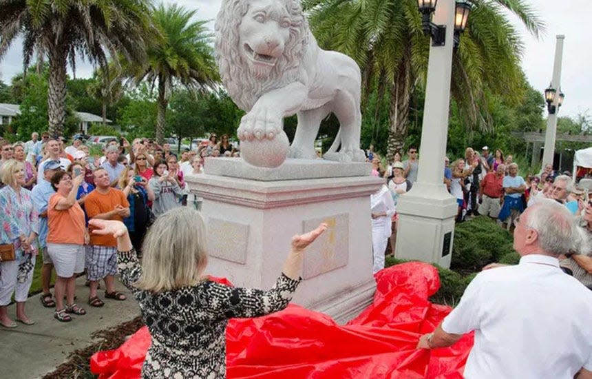 St. Augustine Mayor Nancy Shaver helps unveil one of the new lions on the east side of the Bridge of Lions on July 2, 2015. 