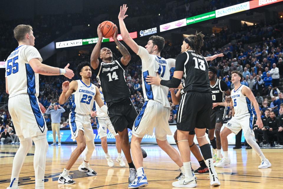 Creighton center Ryan Kalkbrenner tries to block a shot attempt by Providence guard Corey Floyd Jr. during the second half of Saturday's game at CHI Health Center in Omaha.