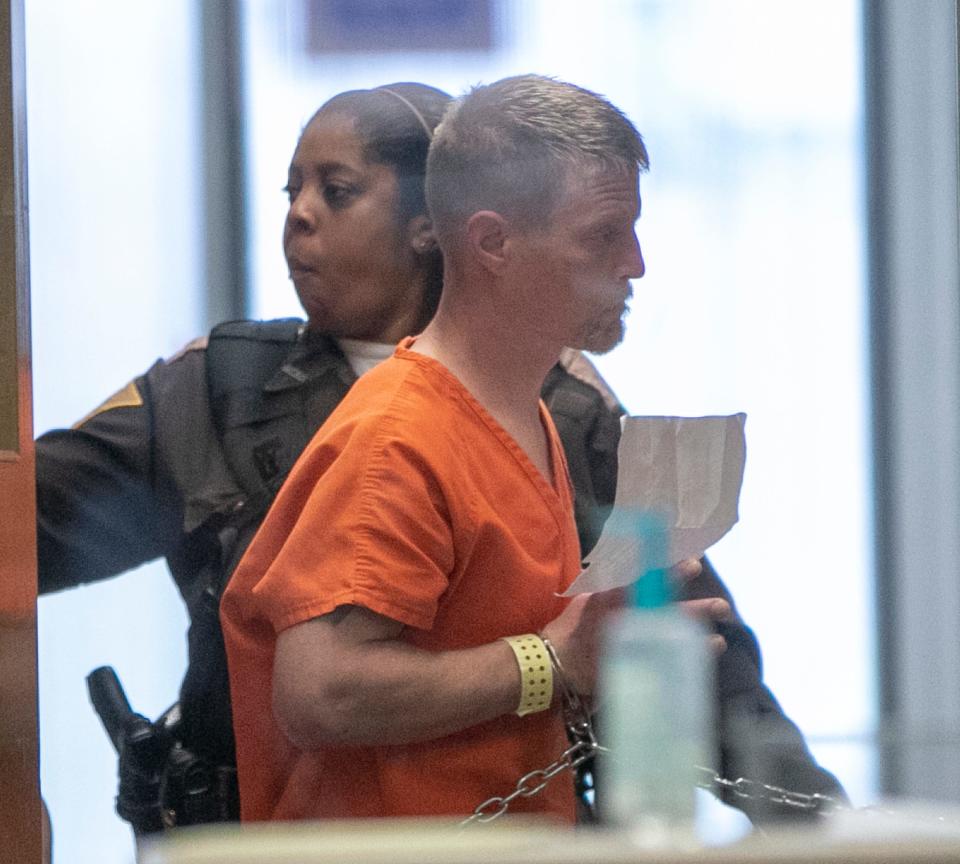 Brandon Kaiser is walked toward a courtroom following arrests in connection with the May 1 shootings of Clark Circuit judges Drew Adams and Brad Jacobs, IMPD said, Wednesday, May 8, 2019. 