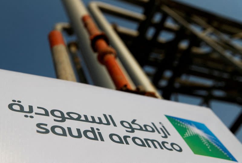 FILE PHOTO: A Saudi Aramco sign is pictured at an oil facility in Abqaiq