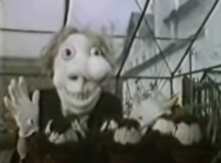 Noseybonk, a deformed creature in a greenhouse