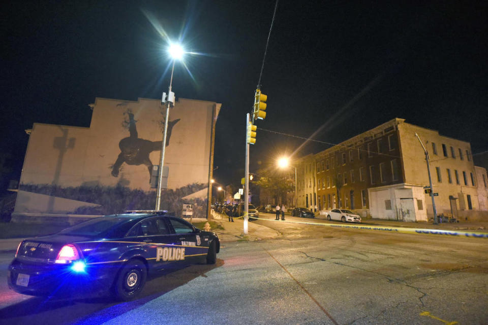 <p>Baltimore police work at a scene where multiple people were shot and wounded in Baltimore, Saturday night, Sept. 24, 2016. The shooting erupted outside some rowhouses about 8:30 p.m. after the three armed men converged on the group from different points, Baltimore Police Commissioner Kevin Davis told The Associated Press. (AP Photo/Steve Ruark)</p>