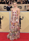 <p>‘The Crown’ actress added a touch of spring to the red carpet in a floral-embellished gown. </p>